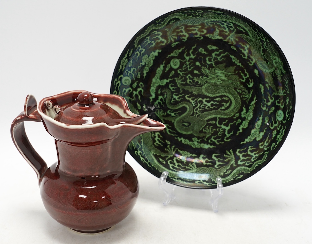 A Chinese famille noire ‘dragon’ dish, 22.5cm diameter, and a Sang de boeuf glaze monk’s cap ewer, Condition - good